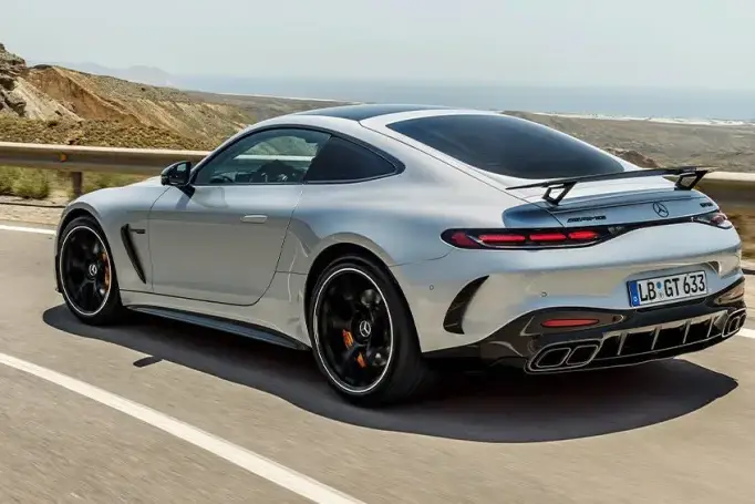 The 2019 porsche 911 gts is driving down a road.