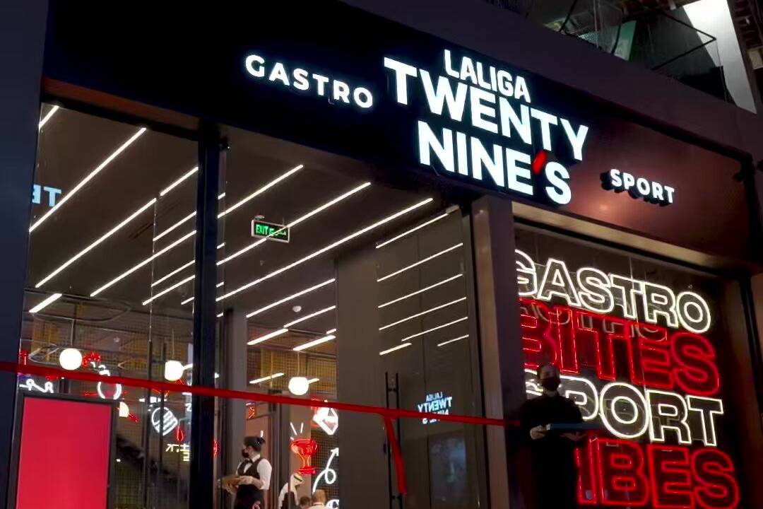 A restaurant with a neon sign that says twenty nine.