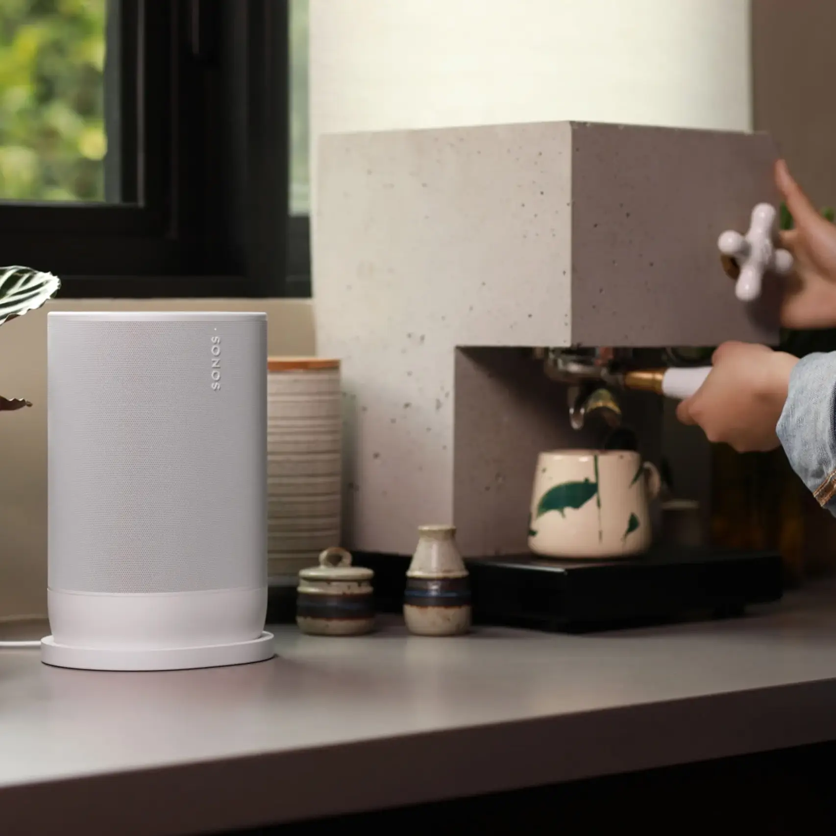 White Sonos speaker on countertop.