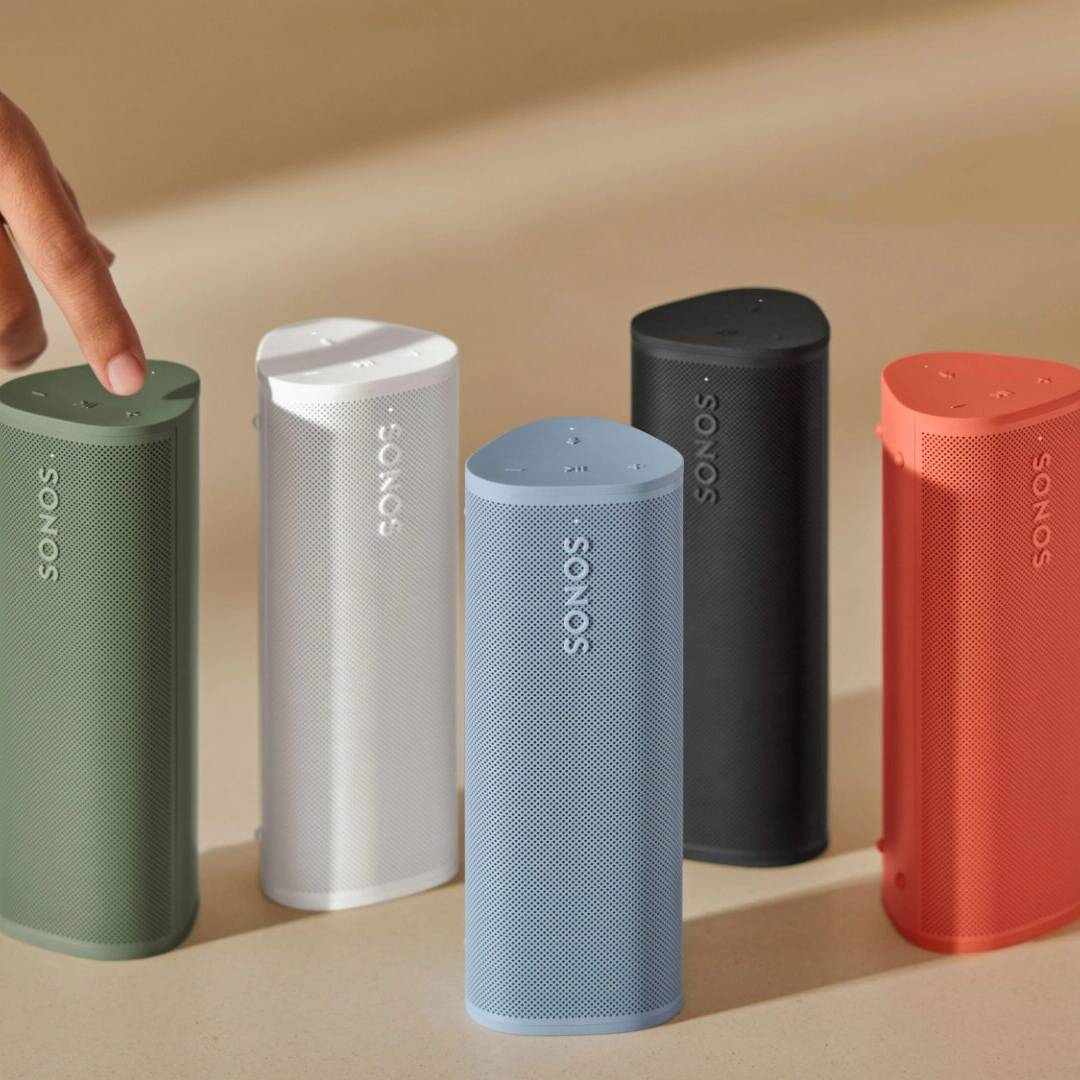 Five Sonos Roam speakers in different colors.